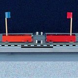 Odgurivanje dva auta jednake mase pomoću opruge